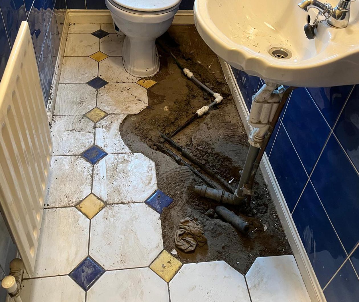 Homeowner With Bathroom Pipe Leak